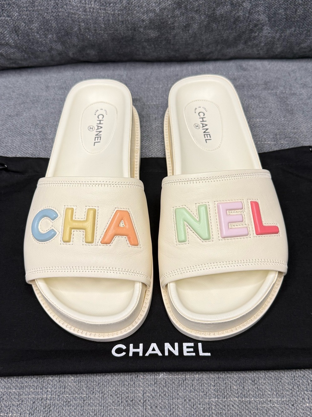 CHANEL Logo ivory lambskin slides sandals